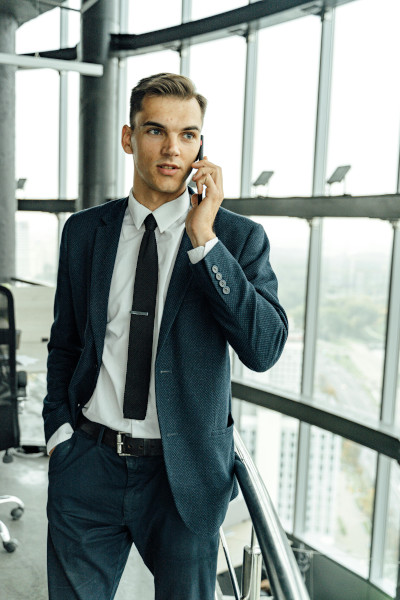 Photo by Antoni Shkraba Studio: https://www.pexels.com/photo/man-in-black-suit-talking-on-the-smartphone-5583984/